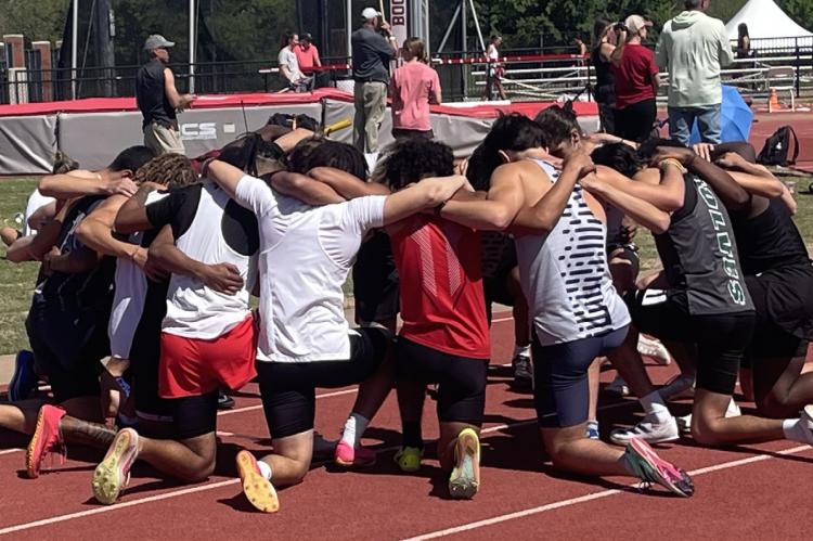 This group of athletes paused to pray before their race! The group was competing at the John Jacob’s Invitational at the University of Oklahoma.